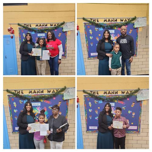 Students pose with Principal, their teacher and families with an award